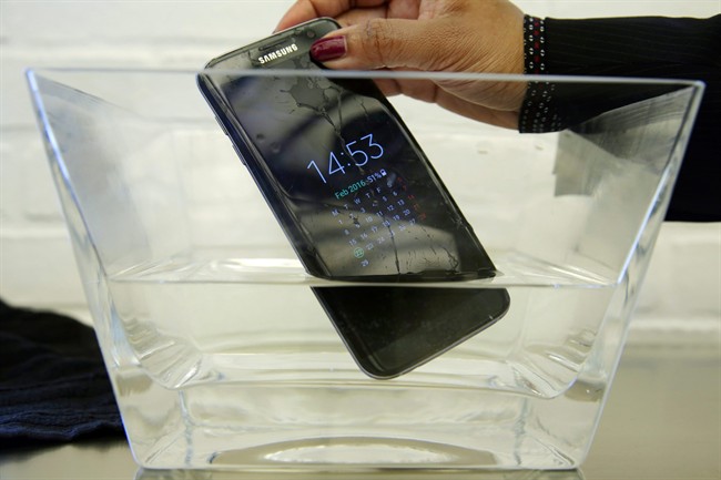 A waterproof Samsung Galaxy S7 Edge mobile phone is submersed in water during a preview of Samsung's flagship store, Samsung 837, in New York's Meatpacking District. SquareTrade, a company that offers extended-protection plans for gadgets, said the Galaxy S7 and S7 Edge still functioned after being submerged in water for 30 minutes.