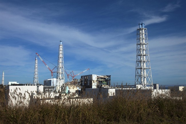 FILE - This Nov. 12, 2011 photo shows a view of the crippled Fukushima Dai-Ichi nuclear power plant in Okuma, Fukushima prefecture, northeastern Japan. After nearly five years of what seemed like an endless battle against the contaminated water at the crippled Fukushima nuclear plant, the utility now has set a 2020 target to put an end to the water woes. (AP Photo/David Guttenfelder, Pool, File).