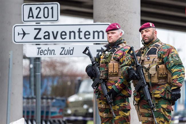 Belgian Army soldiers patrol at Zaventem Airport in Brussels on Wednesday, March 23, 2016. 