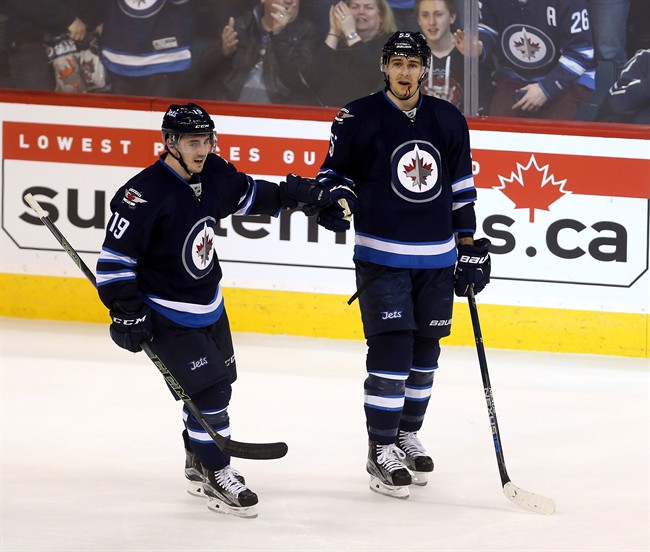 Jets forward Nic Petan (left) is now a Maple Leaf.