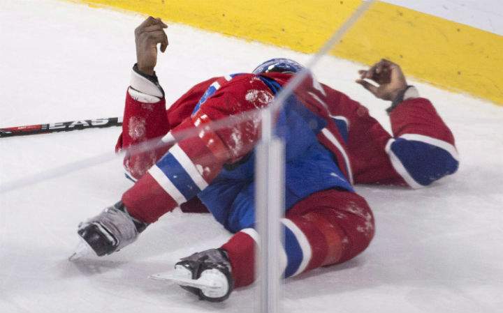 Montreal Canadiens’ P.K. Subban lies injured on the ice during third period NHL hockey action against the Buffalo Sabres in Montreal, Thursday, March 10, 2016.