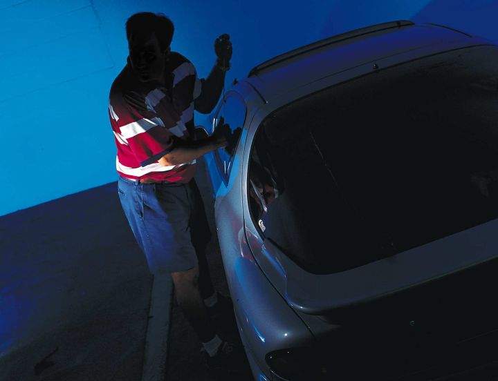A photograph illustrating a car break-in.
