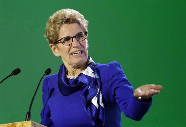 Ontario Premier Kathleen Wynne delivers her speech during a signing ceremony at the COP21, the United Nations Climate Change Conference, Monday, Dec. 7, 2015 in Le Bourget, north of Paris.