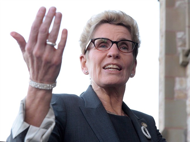 Ontario Premier Kathleen Wynne speaks to reporters in Ottawa on Monday, Nov. 23, 2015.