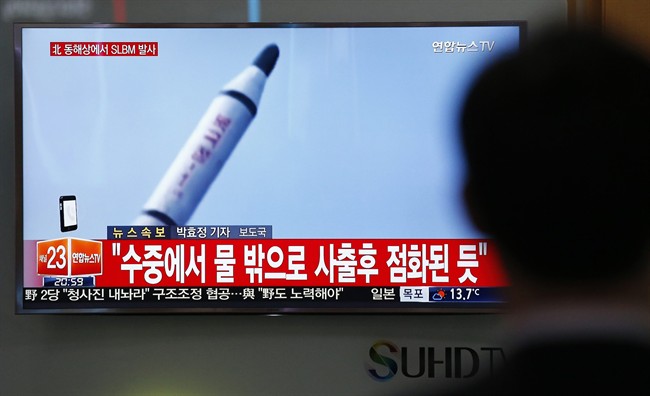 North Korea on Saturday fired what appeared to be a ballistic missile from a submarine off its northeast coast, South Korean defense officials said, Pyongyang's latest effort to expand its military might in the face of pressure by its neighbors and Washington. The Korean letters at top left read: "North Korea fires a submarine-launched ballistic missile or SLBM."