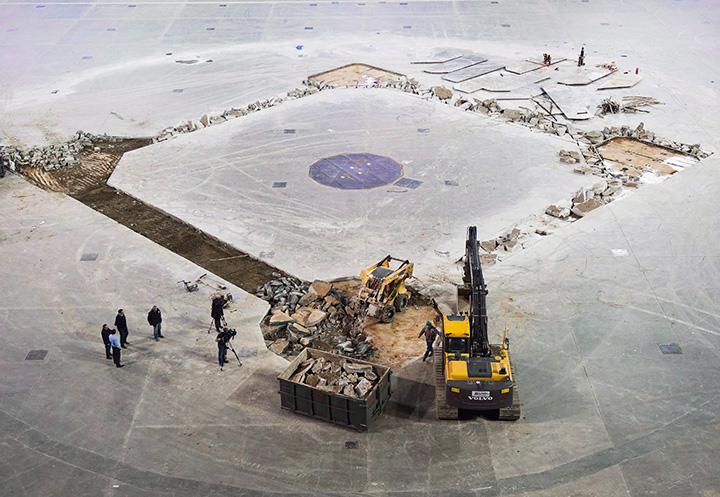 Construction workers hammer out concrete as they install the new dirt infield for the Toronto Blue Jays upcoming season at the Rogers Centre in Toronto on Wednesday, February 10, 2016.