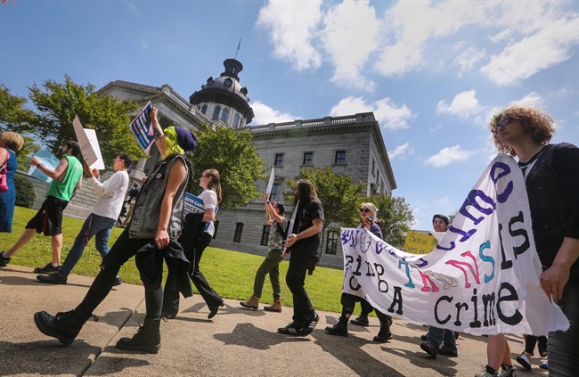 The Trans Student Alliance at University of Southern California holds a rally and news conference at the state Capitol to protest a controversial bill that would ban transgender people from choosing the bathroom they use Wednesday, April 13, 2016, in Columbia, S.C. 