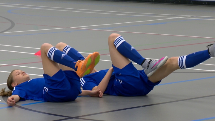 Calgary sisters Emma and Myla Schneider exercising using neuromuscular methods.