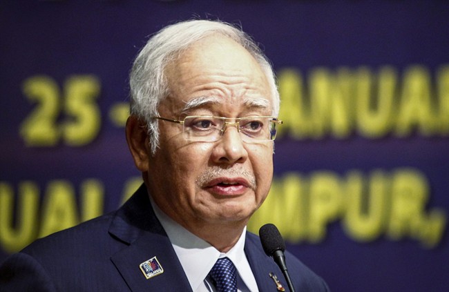 In this Monday, Jan. 25, 2016 file photo, Malaysian Prime Minister Najib Razak delivers his opening speech at a conference in Kuala Lumpur, Malaysia.