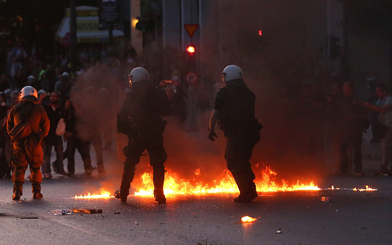 Riot police disperse demonstrators during minor clashes that broke out during a protest against reforms to the tax and pension system which are going to be voted on late on 08 May in the Greek parliament, in Athens, Greece, 08 May 2016.  