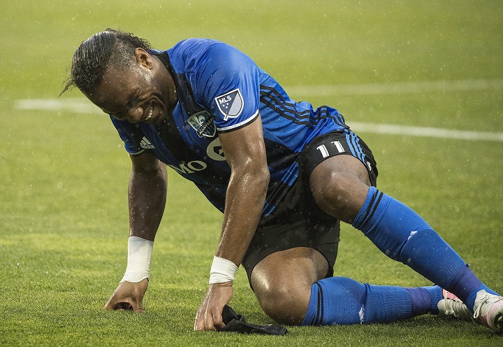 Montreal Impact’s Didier Drogba reacts in pain after suffering an injury during second half MLS soccer action against the Philadelphia Union in Montreal, Saturday, May 14, 2016. THE CANADIAN PRESS/Graham Hughes