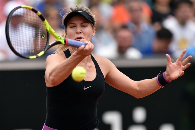 Eugenie Bouchard returns the ball to Angelique Kerber of Germany during their match at the Italian Open tennis tournament, in Rome, Wednesday, May 11, 2016.