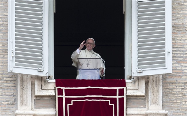 Pope Francis delivers his blessing during the Regina Coeli prayer from his studio's window overlooking St. Peter's Square, at the Vatican, Sunday, May 1, 2016.