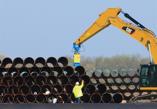 FILE - In this May 9, 2015 file photo, pipes for the proposed Dakota Access oil pipeline that will stretch from the Bakken oil fields in North Dakota to Illinois are stacked at a staging area in Worthing, S.D. 