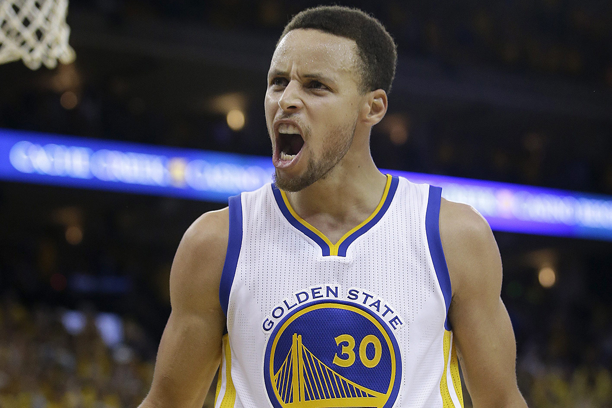 Golden State Warriors guard Stephen Curry (30) reacts after Shaun Livingston scored against the Oklahoma City Thunder during the second half.