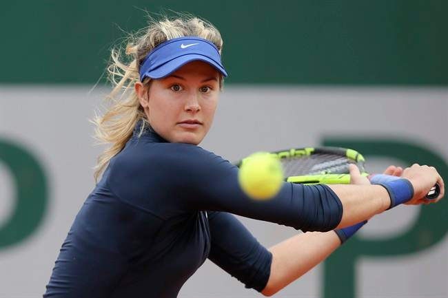Canada's Eugenie Bouchard returns in her first round match of the French Open tennis tournament against Germany’s Laura Siegemund at the Roland Garros stadium in Paris, France, Tuesday, May 24, 2016. 