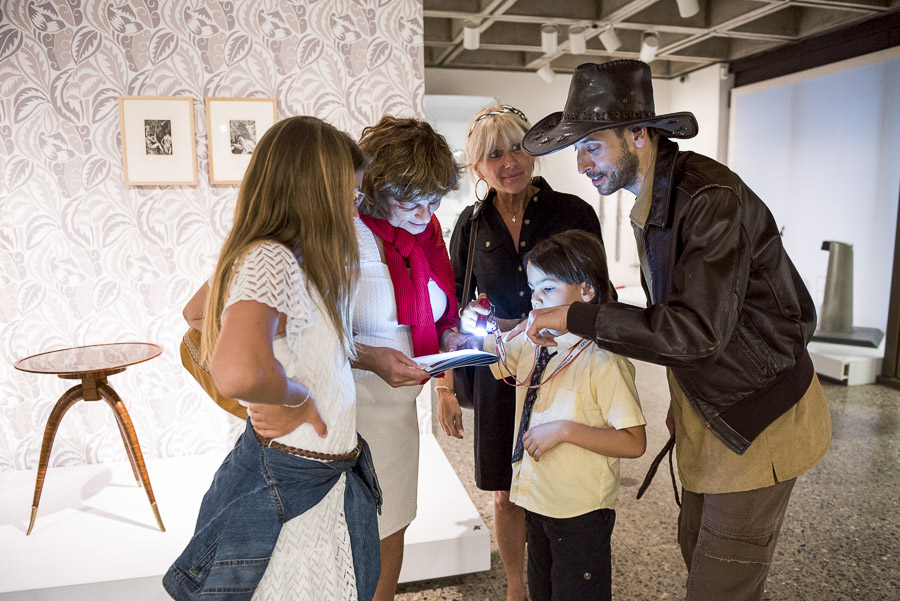 A family solves a puzzle during the Night At The Museum event at Montreal Museum of Fine Arts.
