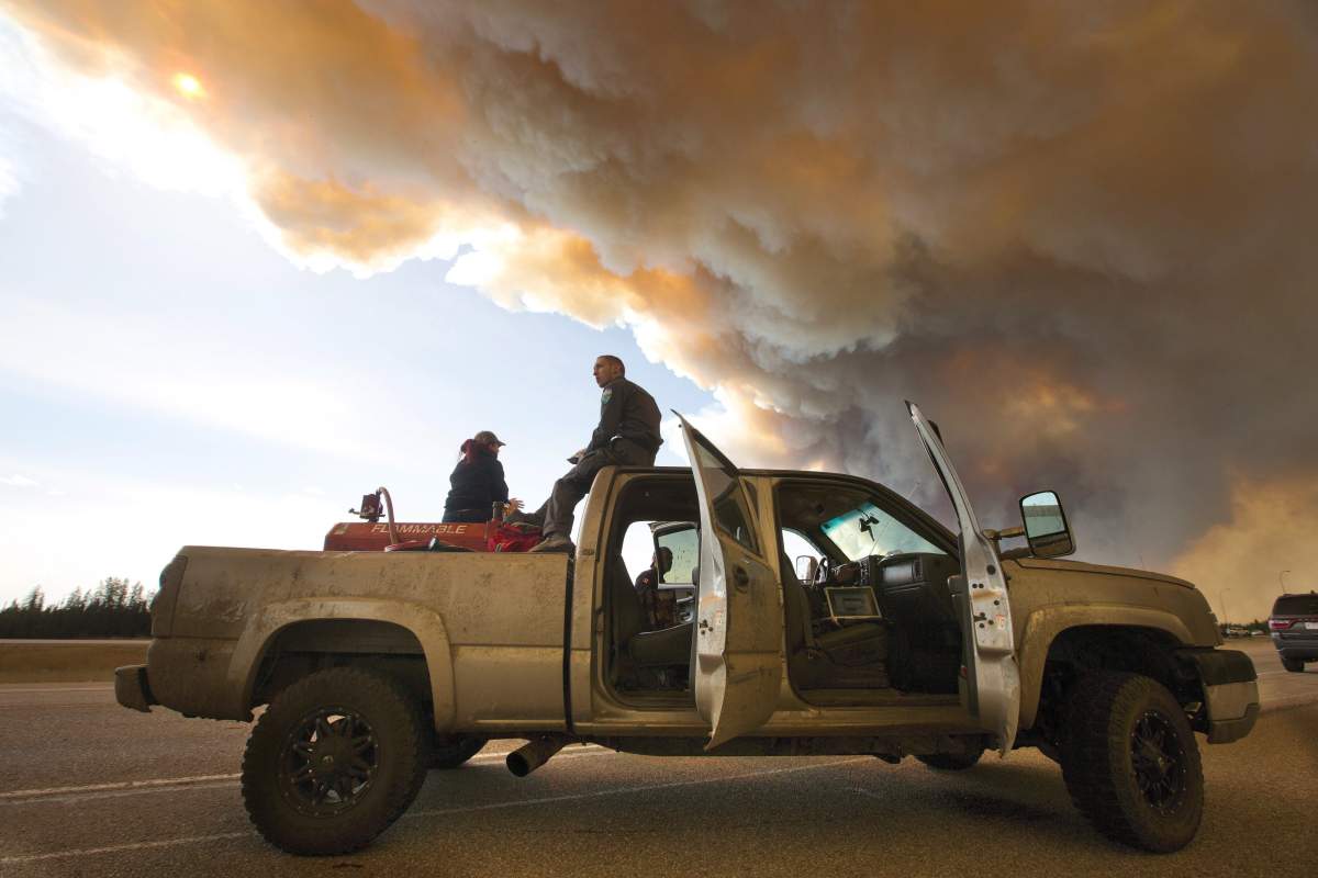 Animal rescue workers wait to get entry to Fort McMurray, Alta., on Friday, May 6, 2016.
