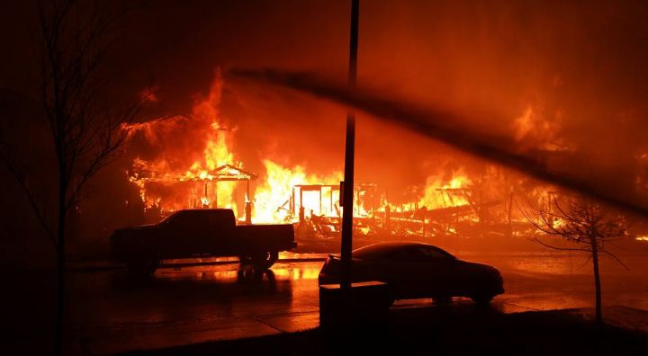Another look at a devastating wildfire as it rips through Fort McMurray. Uploaded to Facebook by a firefighter and EMT with the Regional Municipality of Wood Buffalo on May 6, 2016. Date and exact location of photo is unknown.