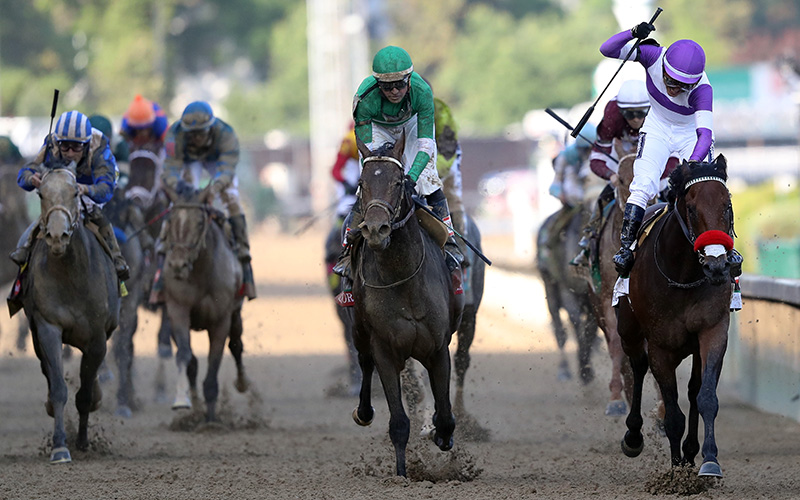 Mario Gutierrez celebrates atop Nyquist #13 after crossing the finish line to win the 142nd running of the Kentucky Derby at Churchill Downs on May 07, 2016 in Louisville, Kentucky. 
