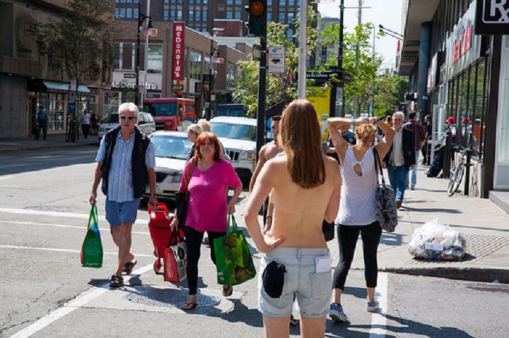 Journalist Lili Boisvert walked around downtown Montreal topless to see what people would do and say, 2014.