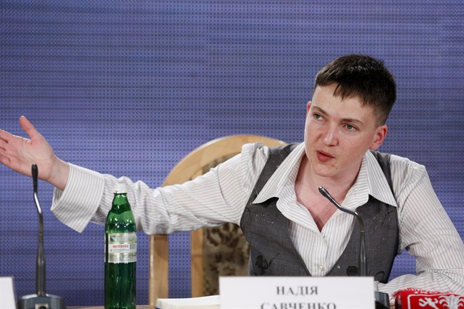 Ukrainian pilot Nadezhda Savchenko, who was freed from a Russian jail, gestures while speaking to the media during her news conference in Kiev, Ukraine, Friday, May 27, 2016. Savchenko, who came home on Wednesday after two years in Russian custody says she would run for president if that's what Ukrainians desire. (AP Photo/Sergei Chuzavkov).