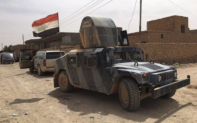 Iraqi security forces patrol after defeating Islamic State militants in Fallujah, Iraq, Sunday, June 26, 2016. 