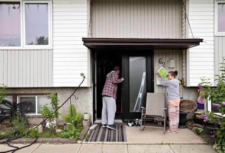 Mike Maloney and his wife Tessa check over their home as they re-enter after being evacuated due to wildfires, in Fort McMurray Alta, on Wednesday June 1, 2016. Parts of Fort McMurray have been open for the public to go back home.