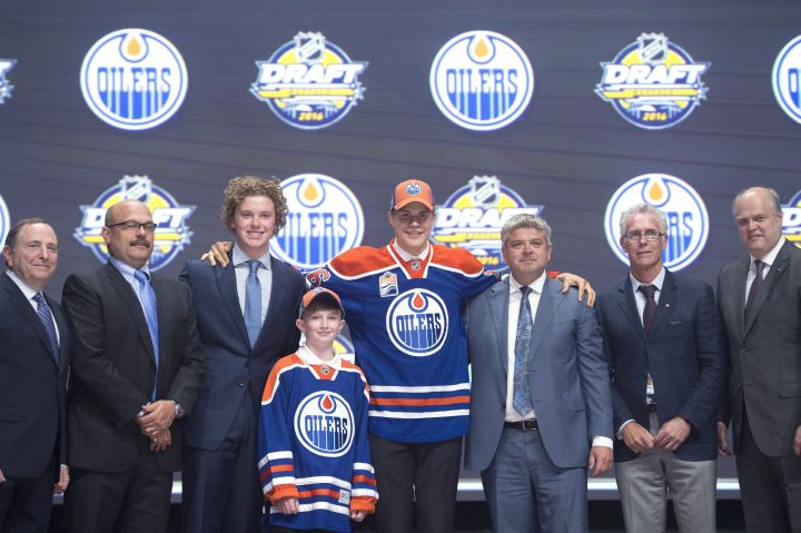 Jesse Puljujarvii, fourth overall pick, stands on stage with members of the Edmonton Oilers management team at the NHL draft in Buffalo, N.Y. on Friday June 24, 2016.
