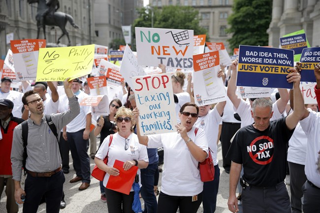 Opponents of a proposed sugary drink tax demonstrate outside City Hall in Philadelphia, Wednesday, June 8, 2016. 