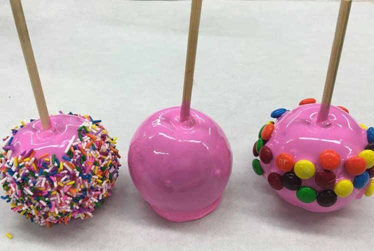 Pink strawberry flavoured candy apple