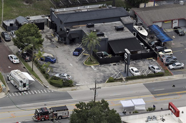  In this June 12, 2016 file photo, law enforcement officials work at the Pulse nightclub following a fatal shooting, in Orlando, Fla. 