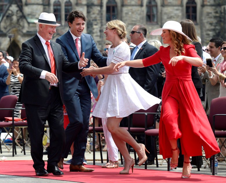 Governor General David Johnston, left to right, Prime Minister Justin Trudeau, Minister of Canadian Heritage Melanie Joly and Sophie Gregoire Trudeau dance during Canada Day celebrations on Parliament Hill.