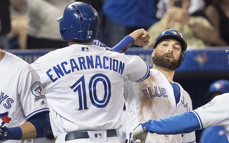 Toronto Blue Jays' Edwin Encarnacion, left, is congratulated by teammate Kevin Pillar after he hit a three run home run against the Detroit Tigers in the seventh inning of their American League MLB baseball game in Toronto Friday July 8, 2016. 