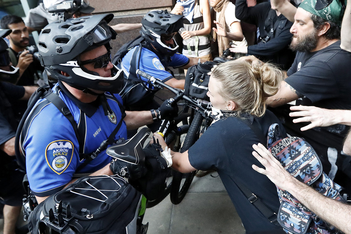 Protesters clash with police on Tuesday, July 19, 2016, in Cleveland, during the second day of the Republican convention.