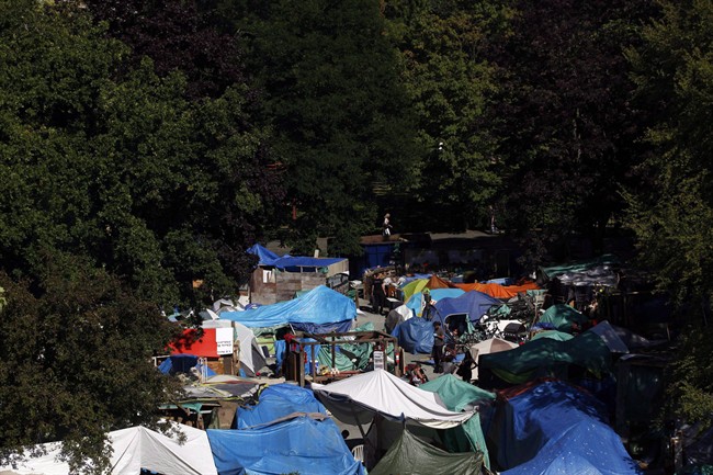 Residents at Tent City, also known as Super InTent City, are seen in Victoria, B.C., Tuesday, June 28, 2016 .