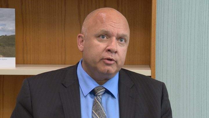 Dan Florizone, the Saskatoon Health Region's CEO, says officials will try to minimize layoffs with a hiring freeze and by having current employees to fill vacant roles.