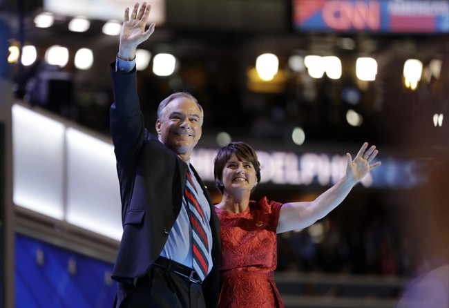 Democratic vice presidential candidate, Sen. Tim Kaine waves with his wife Anne Holton during the third day session of the Democratic National Convention in Philadelphia, Wednesday, July 27, 2016.