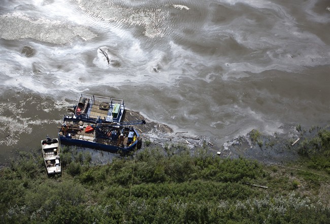 Crews work to clean up an oil spill on the North Saskatchewan river near Maidstone, Sask on Friday July 22, 2016.