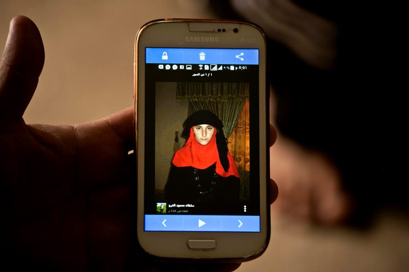 Islamic State group militants took this photo of Yazidi girl Nazdar Murat, as part of a database the militants have put together of Yazidi girls and women they have enslaved, shown in this May 18, 2016, photo taken during an interview with her family at Kankhe Camp for the internally displaced in Dahuk, northern Iraq.