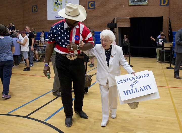 Hillary Clinton supporter Jerry Emmett carries a "centenarian for Hillary" sign at a Clinton campaign event in Phoenix in March 2016.