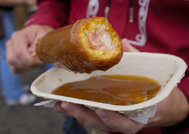 A Poutine Corn Dog at the Calgary Stampede in Calgary, Saturday, July 9, 2016.