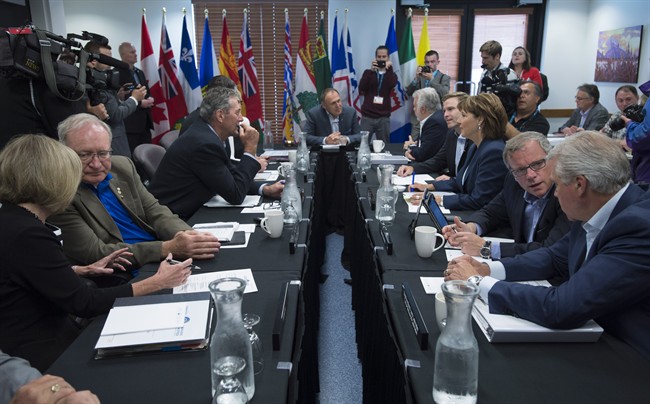 Provincial premiers are seen at the beginning of their meeting in Whitehorse, Yukon, Thursday, July, 21, 2016.