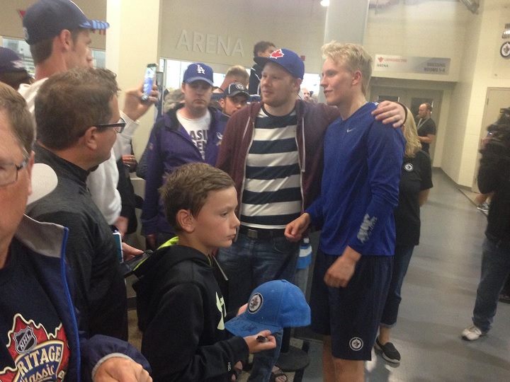 Patrik Laine poses for a picture at the MTS Iceplex on Sunday.