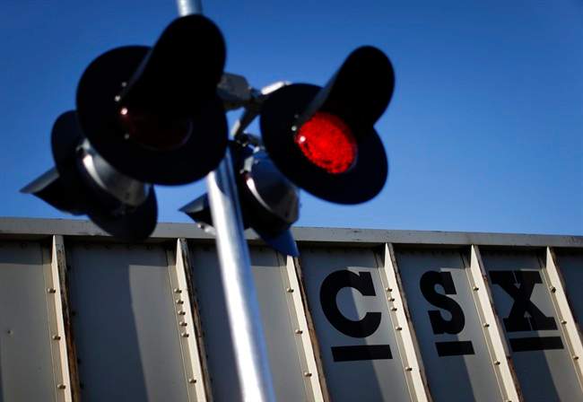In this March 22, 2014, file photo, a CSX freight train rolls past a grade crossing in Mount Airy, Md. A man was injured after he was struck by a freight train at the AMT Île-Perrot station. Friday, Jan. 20, 2017.
