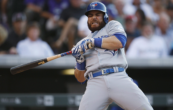 Toronto Blue Jays' Russell Martin reacts as he gets hit by a pitch from Colorado Rockies starting pitcher Jon Gray in the second inning of a baseball game Monday, June 27, 2016, in Denver. 