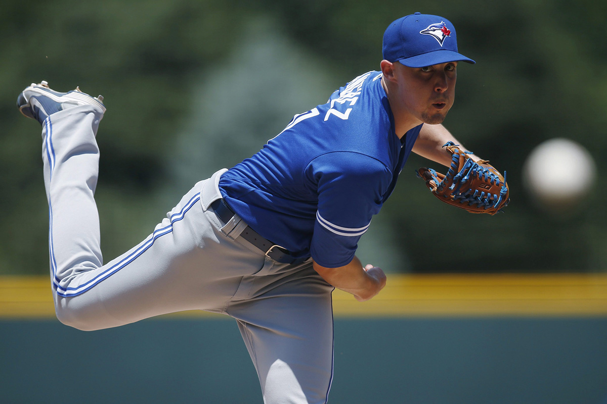 Toronto Blue Jays starting pitcher Aaron Sanchez delivers a pitch to Colorado Rockies' Charlie Blackmon in the first inning of a baseball game Wednesday, June 29, 2016, in Denver.
