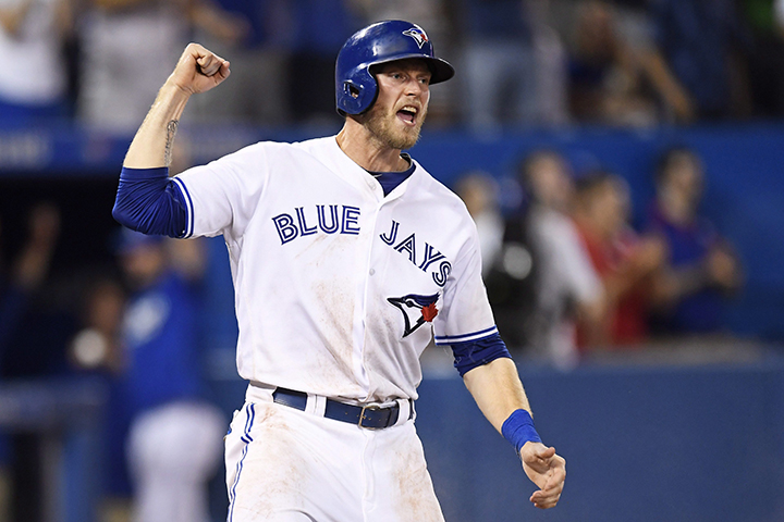 Toronto Blue Jays' Michael Saunders celebrates after scoring on a two-run single by Troy Tulowitzki against the Detroit Tigers during eighth inning MLB baseball action, in Toronto on Thursday, July 7, 2016. 