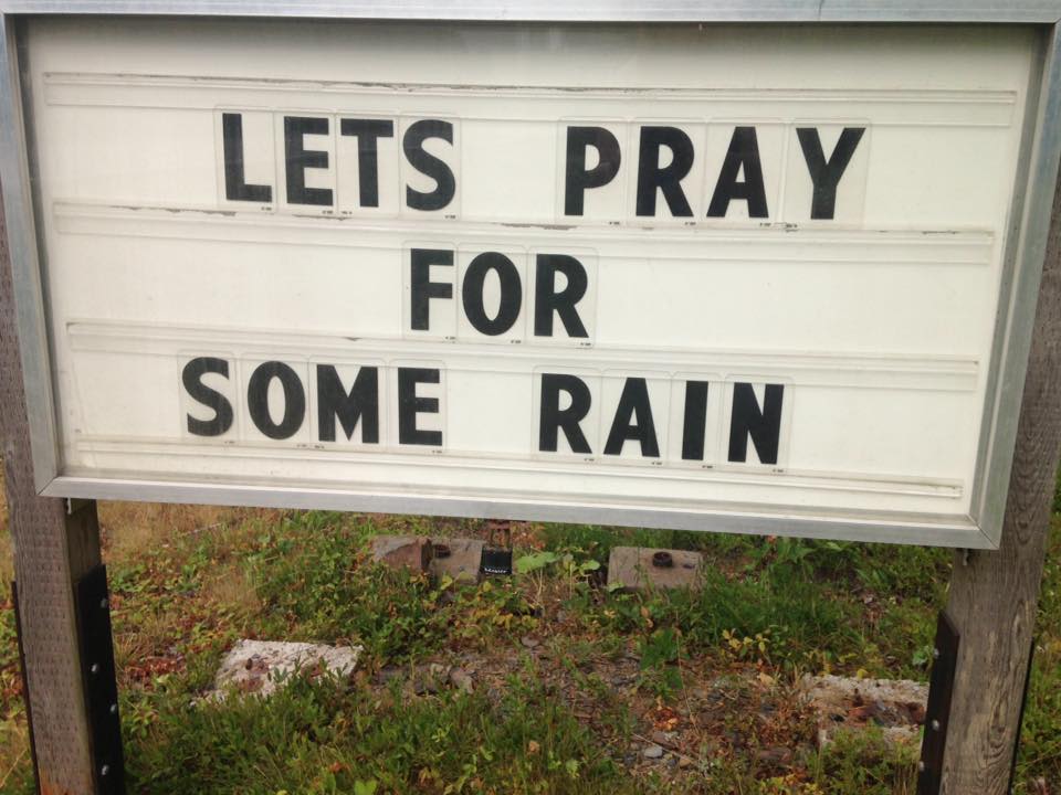 A sign near Kejikjukik National Park reads “lets pray for some rain” as the province battles several wildfires throughout Nova Scotia.
