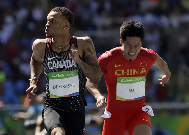 Canada\’s Andre De Grasse, left, and China\’s Su Bingtian compete in a men\’s 100-meter heat during the athletics competitions of the 2016 Summer Olympics at the Olympic stadium in Rio de Janeiro, Brazil, Saturday, Aug. 13, 2016.